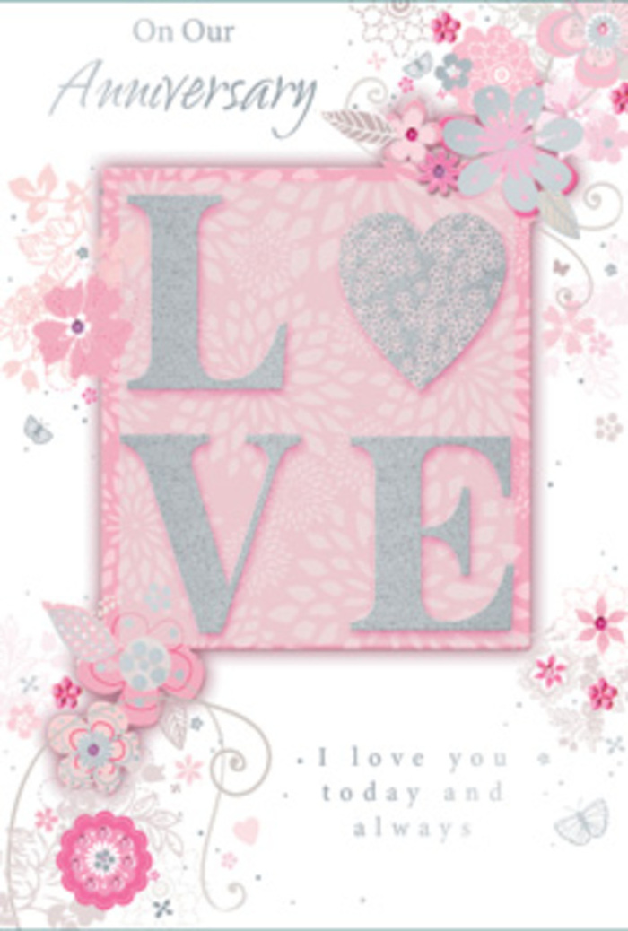 In this image, an anniversary card is presented like a delicate artwork, its palette of blush pink, ivory, and silver evoking the gentle charm of Crouch End's leafy streets and independent boutiques. Dominating the centre of the card is the word LOVE, rendered in tall, embossed capital letters and lavishly dusted with fine, pale glitter. The glitter forms a slightly raised surface that would feel almost velvety to the touch, catching the light with a subtle shimmer, similar to the way evening light dances on shopfront windows along The Broadway. These letters rest upon a soft blush-pink rectangular block, which stands out gently from the lighter background, signalling the emotional heart of the design. The rest of the card's surface is filled with a dreamy, pastel backdrop that transitions from pale pink near the centre to an almost white tone at the edges, giving the impression of diffused light. Flowing around the central word, delicate illustrated flowers and leaves arc in graceful patterns. The blooms are sketched with slender lines in silver-grey and white, with minute silver accents along the edges of petals and the tips of leaves, reminiscent of fine foil detailing. The flowers appear small and ethereal, more like visual whispers than bold botanical studies, as if a florist had imagined a cloud of petals drifting across the card. Curved stems, fine swirls, and clusters of tiny dots add a sense of motion, suggesting a gentle breeze. Above and beneath this central floral embrace, the anniversary sentiment is written in a flowing script, the ink a soft charcoal-grey that harmonises without dominating. The card's overall impression is of quiet, enduring love, perfectly suited to accompany same-day flower delivery across Crouch End for a couple marking years of shared memories.